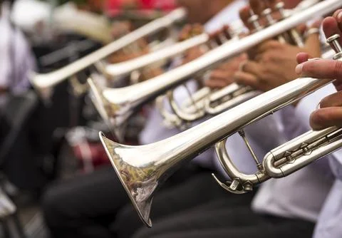 Wind instruments. Hands on musical instruments. Musicians play pipes.  Hand.. Stock Photos