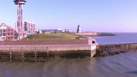 Wind mill and wind turbines in Dutch town Vlissingen. Stock Footage 33643996