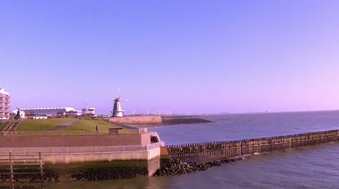 Wind mill and wind turbines in Dutch town Vlissingen. Stock Footage 35154114
