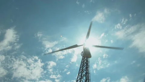 Wind mill, clouds and blue sky. Wind power turbines generating renewable clean Stock Footage 156477775