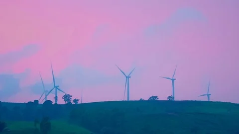 Wind mill or also wind-turbine on wind farm in rotation Stock Footage 90782348