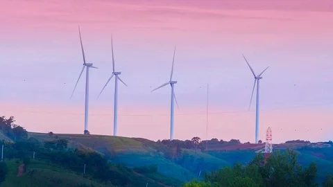 Wind mill or also wind-turbine on wind farm in rotation Stock Footage 90782737