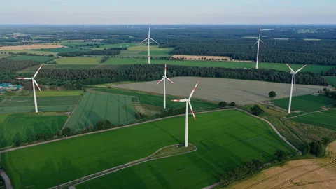 Wind mill for renewable electric energy production. Windmill in a rural area Stock Footage 346174938