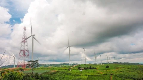 Wind mill turbine rotation on the cloudy sky, conservation green energy concept Stock Footage 82207374