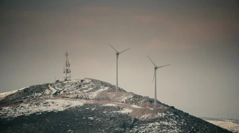 Wind mill turbines blades rotating generating power on mountain long shot Stock Footage 47009515