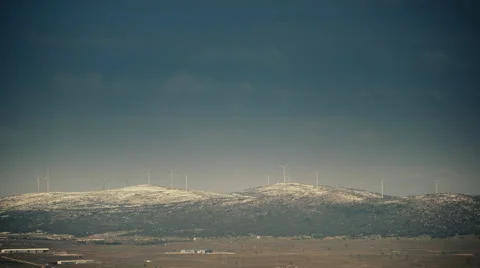 Wind mill turbines blades rotating generating power mountain long shot Stock Footage 47010004