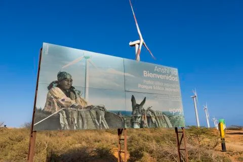 Wind mills in El Cabo De La Vela and sign board about Wayuu, Colombia Stock Photos
