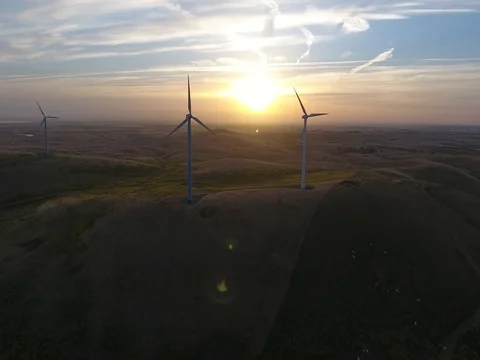 Wind mills high shot of a sunset Stock Footage 76156735