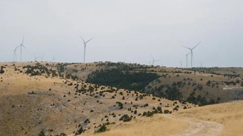 Wind mills on wind farm in Mostar, Bosnia and Herzegovina. Green energy Stock Footage 249042614