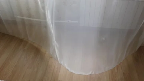 The wind moves the curtain on the window Stock Footage 138711067