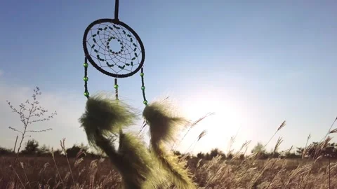The wind moves the feathers of the dream catcher. Stock Footage 258044031