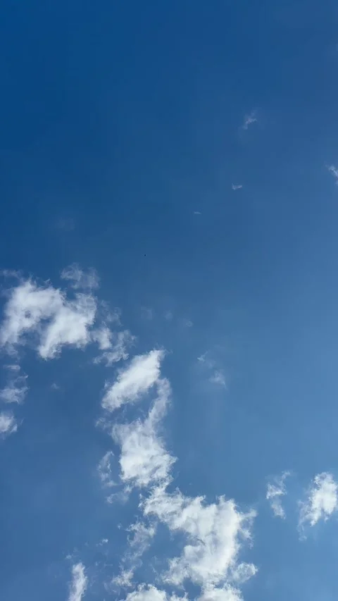 Wind moving clouds, clear blue sky background, Stock Footage 243731849