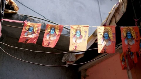 Wind moving prayer flags with hindu deity Stock Footage 288233383