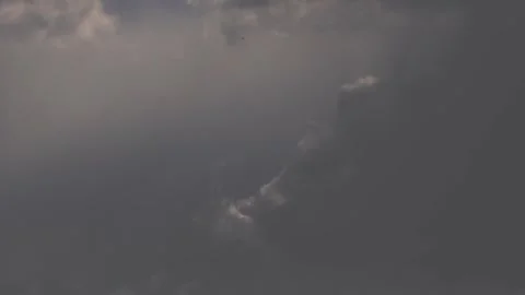 Wind moving small cloud against gray sky. Stock Footage 338354198