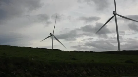 Wind moving wind turbines and clouds in the mountains of Ourol, Spain Video stock 266840549