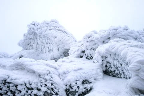 Wind painted Snow Texture Pattern on stone Background, Winter background. Stock Photos