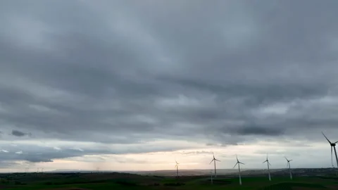 Wind park and dramatic sky at dusk Видео 221092045