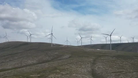 Wind power energy - electricity production - Power lines transmission lines - 4K Stock-Footage 336191453