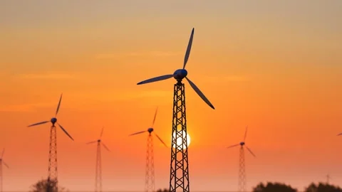 Wind power equipment and windmills on the grassland at sunset Stock Footage 336083795