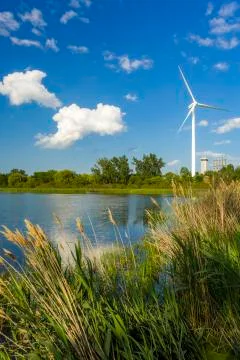 Wind power generating stations in the park Stock Photos