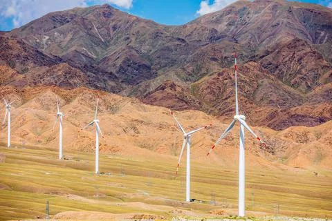 Wind power generation and mountain natural scenery in Xinjiang. Stock Photos