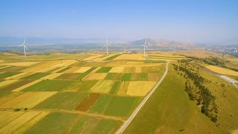 Wind power generators and yellow field drone view 스톡 동영상 94536149