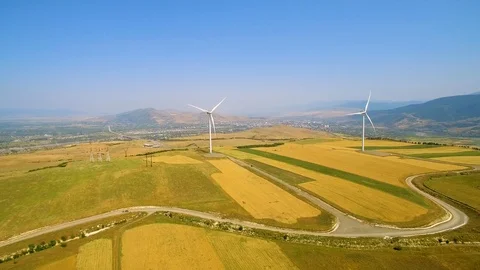 Wind power generators and yellow field aerial panorama view 스톡 동영상 94536159