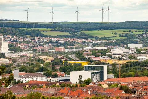 Wind power generators on a background of cloudy sky. Stock Photos