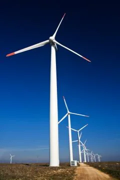 Wind power generators on blue sky Stock Photos