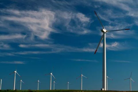 Wind power generators on blue sky Stock Photos