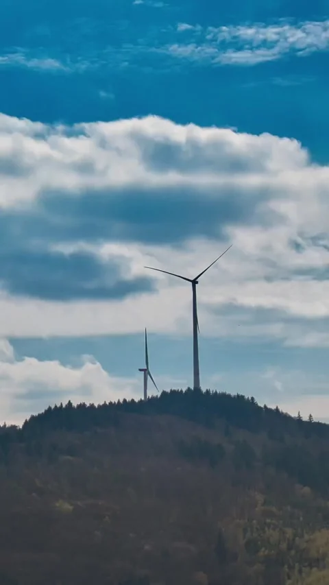 Wind power generators for electricity on a mountain in a vertical time-laps.. Stock-Footage 239902585