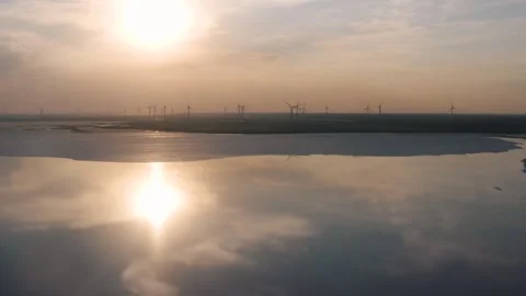 Wind power generators in the field on the coastline Stock Footage 255624118