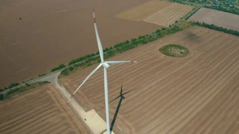 Wind power generators in the field Stock Footage 255622050