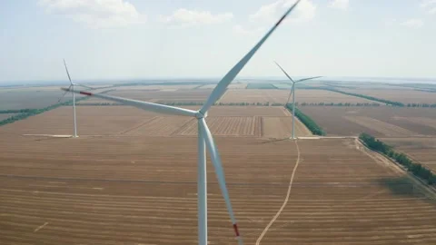 Wind power generators in the field Stock Footage 255622231