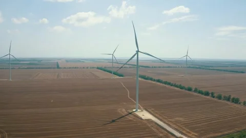 Wind power generators in the field Stock Footage 255622251