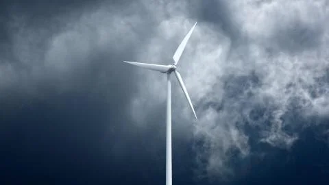 Wind power generators on sky background. Ilustración de archivo