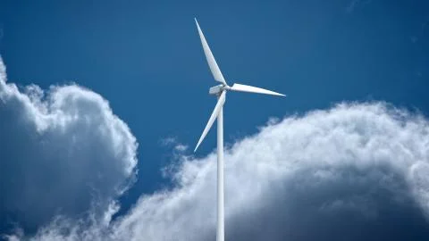 Wind power generators on sky background. Ilustración de archivo