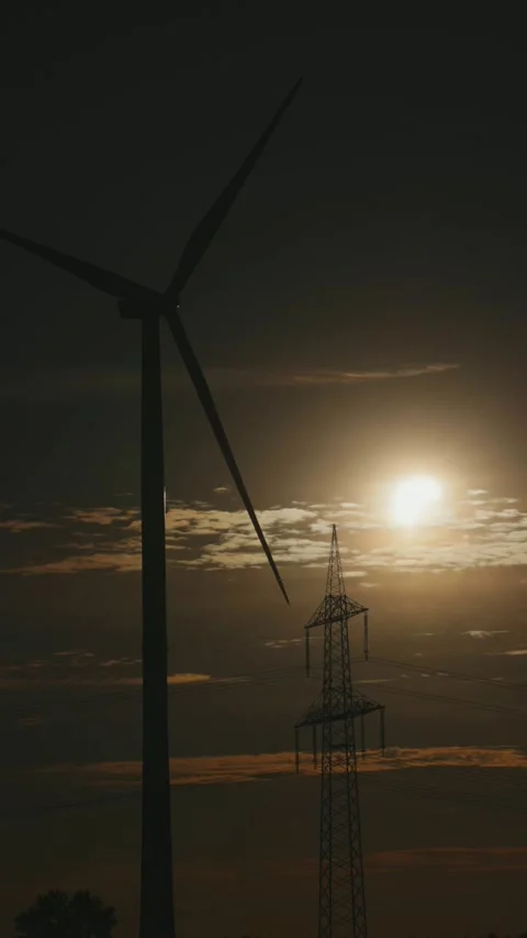Wind power plant, high-voltage mast, sun, clouds, partial solar eclipse, Stock Footage 342189573