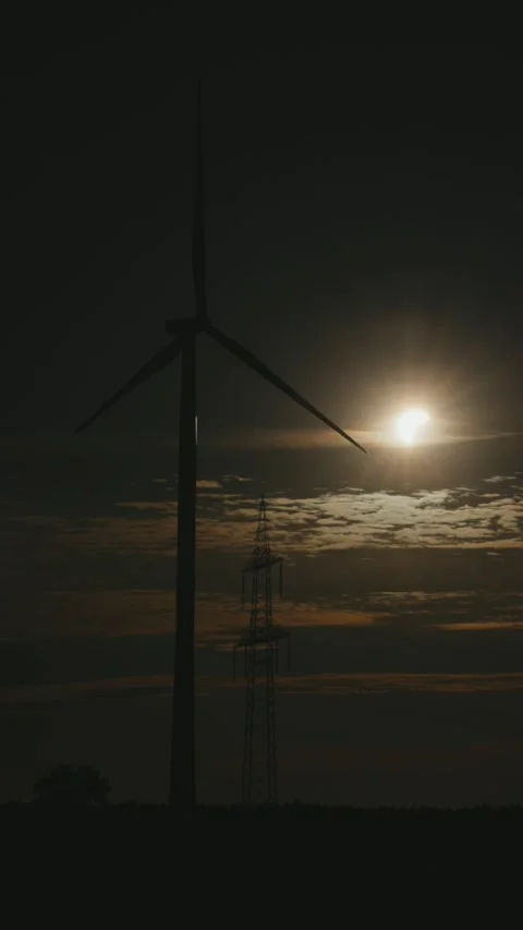 Wind power plant, high-voltage mast, sun, clouds, partial solar eclipse, Stock Footage 342189709