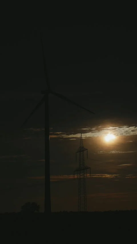 Wind power plant, high-voltage mast, sun, clouds, partial solar eclipse, Stock Footage 342189831