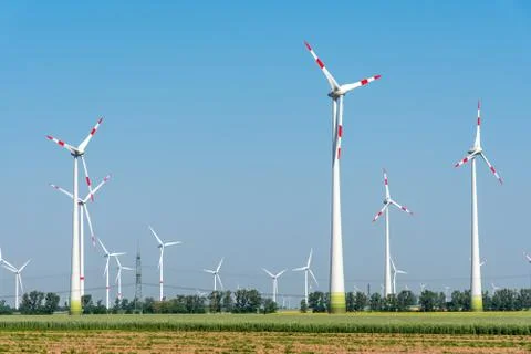 Wind power plants in the fields Stock Photos