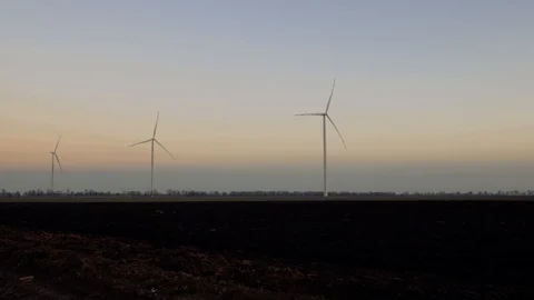 Wind power plants. wind generators at work Stock Footage 104044142