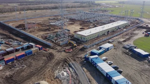 Wind power station building in progress in the middle of the field, 4k Stock Footage 133558861
