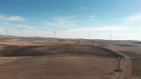 Wind power stations in the desert white power cells Stock Footage 98212273
