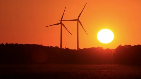 Wind power at sunrise red sky, clean and renewable energy  Stock Footage 218665119