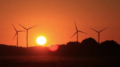 Wind power at sunrise red sky, clean and renewable energy  Stock Footage 218779930