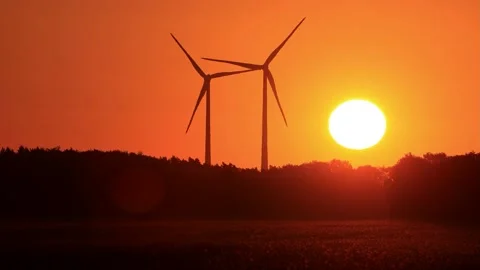 Wind power at sunrise red sky, clean and renewable energy  Stock Footage 218865924