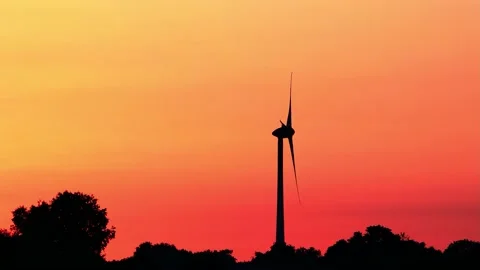 Wind power at sunrise red sky, clean and renewable energy  Stock Footage 221509358
