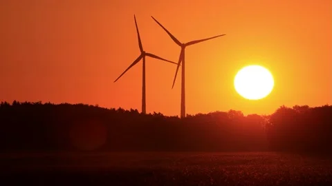 Wind power at sunrise red sky, clean and renewable energy  Stock Footage 231034977