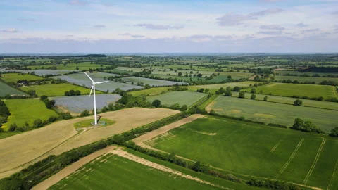 Wind power turbine generating clean renewable energy in green English 動画素材 162228577